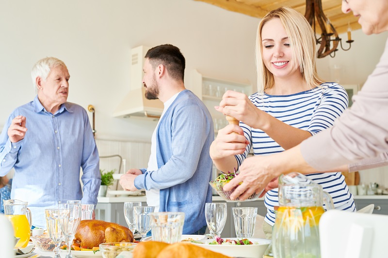 Modern Happy Family Setting Dinner Table